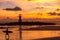 The scenery of the silhouette of Khao Lak Light Beacon in sunset time with the dramatic twilight sky at Nang Thong Beach, Phang