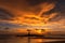 The scenery of the silhouette of Khao Lak Light Beacon in sunset time with the dramatic twilight sky at Nang Thong Beach, Phang