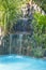 Scenery small waterfall with plants in the pool