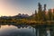 Scenery of Three sisters mountain reflection on pond at sunrise in autumn at Banff national park