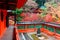Scenery of a traditional Japanese corridor and a pavilion surrounded by fiery maple trees in the garden