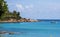 Scenery view Italian island Sardinia sea shore beach rock coast and anchored boat in Arbatax sardegna