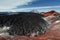 Scenery volcanic landscape - frozen lava field in colorful crater of active volcano