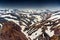 Scenery of volcanic mountain and snow covered in Blahnjukur trail on Icelandic highlands at Landmannalaugar