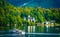 Scenery of white ancient castle in the autumn forest and wide lake in Hallstatt,Austria