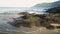 Scenery of Yanui Beach with waves and hills under blue sky at west coast.