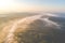 Scenic aerial landscape of river mist and sunrise