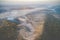 Scenic aerial landscape of river mist and sunrise