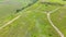 Scenic aerial panoramic view of idyllic rolling hills summer landscape