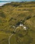 Scenic aerial shot of a farmhouse with beautiful natural surroundings in the Glencoe