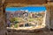 Scenic aerial stone window view over the ruins of the Roman Forum in Rome