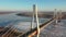 Scenic aerial view of cable-stayed bridge over frozen Oka river near Murom city of Vladimir region on sunny winter day