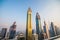 Scenic aerial view on downtown Dubai, United Arab Emirates with skyscrapers and highways. Colourful travel background