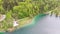 Scenic Aerial view of Mountain Lake with Turquoise Clean Water and Green Forest