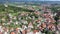 Scenic aerial view of Slovenian township of Vrhnika in valley between Ljubljana Hills in autumn day