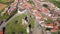Scenic aerial view of small Portuguese township of Mogadouro with brownish tiled roofs of residential buildings