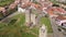 Scenic aerial view of small Portuguese township of Mogadouro with brownish tiled roofs of residential buildings