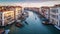 Scenic aerial view of a Venetian canal, with gondolas. AI-generated.