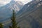 Scenic alpine landscape with great mountain under cloudy sky.