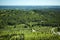 Scenic amazing view from Les Baux-de-Provence castle of Luberon valley in Provence, France. Sunny day and blue sky above green