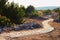 Scenic ancient winding cobble stone pathway along the ruins of antique buildings