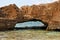 Scenic arch rock in sea water