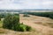 Scenic areal view on green summer woods in Pidkamin village