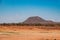 Scenic arid landscapes against sky at Tsavo West National Park in Kenya
