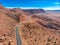 Scenic asphalt road in Grand Canyon mountains at hot summer day. Aerial view