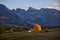 Scenic autumn landscape in the mountains with backlighted yellow larch, Alpe di Siusi, Dolomite Alps, Italy