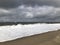 Scenic autumn sandy beach with waves and dunes in Sylt