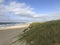 Scenic autumn sandy beach with waves and dunes in Sylt