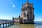 Scenic Belem Tower and wooden bridge miroring with low tides on Tagus River. Torre de Belem is Unesco Heritage and icon of Lisbon