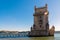 Scenic Belem Tower and wooden bridge miroring with low tides on Tagus River. Torre de Belem is Unesco Heritage and icon of Lisbon