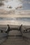 Scenic biscarrosse beach in sunset with clouds and wooden footpath stairs, france