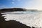 Scenic black sandy beach and ocean waves in Lanzarote