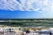 Scenic Black Sea seascape in Anapa resort in Russia. Waves splashing on sandy seashore under blue sky and clouds on sunny day