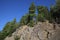 Scenic bottom-up view of the mountains and pine trees.