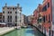 Scenic canal with colorful ancient houses, Venice, Italy