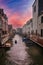 Scenic Canal in Venice: Sunny Day Illuminates Traditional Architecture and Serene Waterway