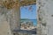 Scenic Caribbean View Through Rustic Window Frame