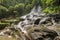 Scenic cascade Goa Giri Campuhan waterfall in tropical jungle in
