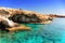 Scenic cave, blue mediterranean water.