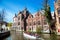 Scenic cityscape with medieval houses, boat and canal in Brugge, Belgium