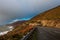 Scenic cloudy view over Atlantic coastline and road, Dingle peninsula, County Kerry, Ireland