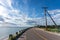 Scenic coastal road next to the ocean under blue sky