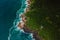 Scenic coastline with house, rocks and ocean with waves in Brasil. Aerial view