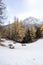 Scenic cold winter landscape with snow and trees and bench in Sauze D`Oulx