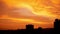 Scenic colorful sunset skyline timelapse over silhouette city & yellow red orange sky