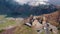 scenic drone shot of Gergeti Trinity Church and snowy Caucasus mountains, Kazbegi, Stepantsminda region, Georgia